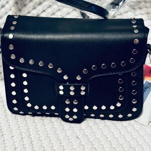 New Dream Crossbody small black with silver divots flap with snap closure